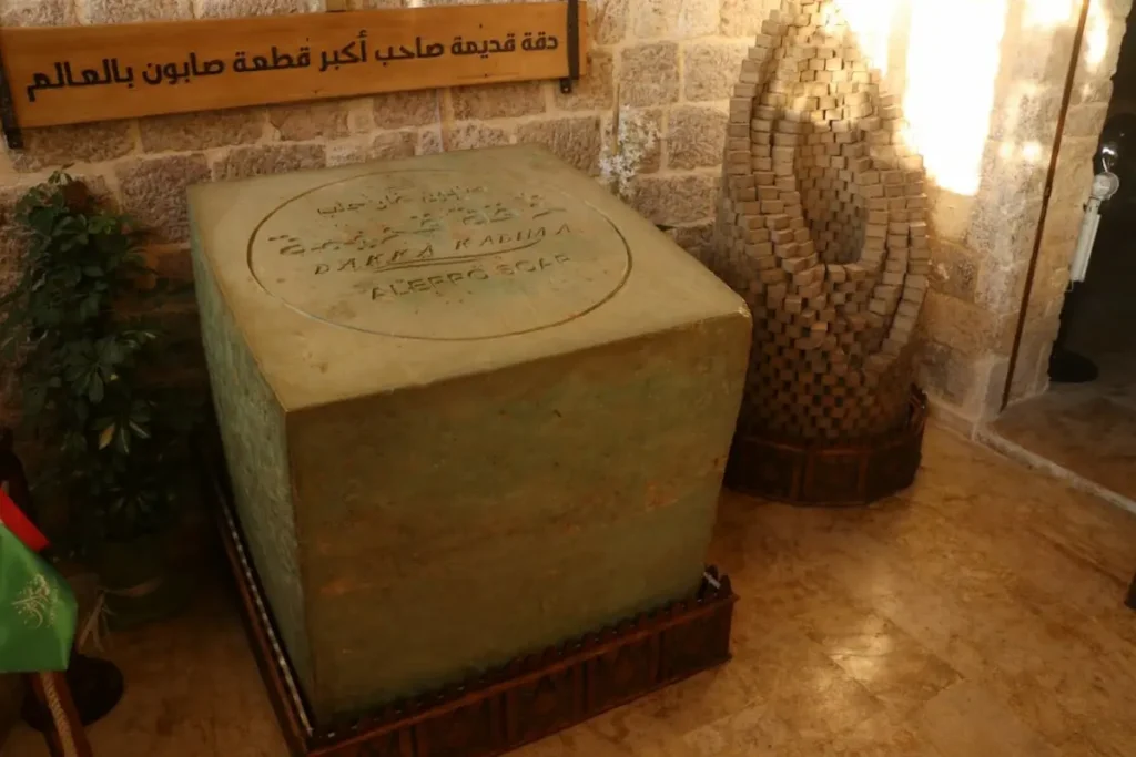 The world's largest piece of Aleppo laurel soap, weighing 1,520 kg, displayed at the Dakka Kadima factory shop in Syria.